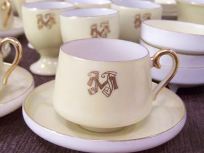 Small cup and saucer with monogram